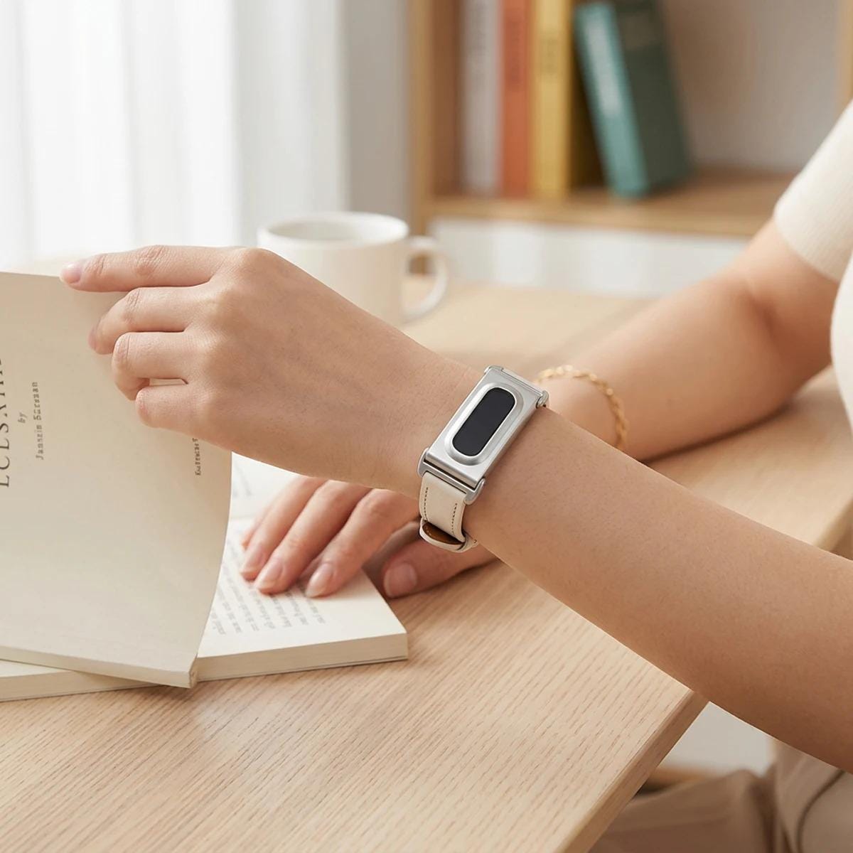 Google Fitbit Air leather-style strap with buckle and metal case detail
